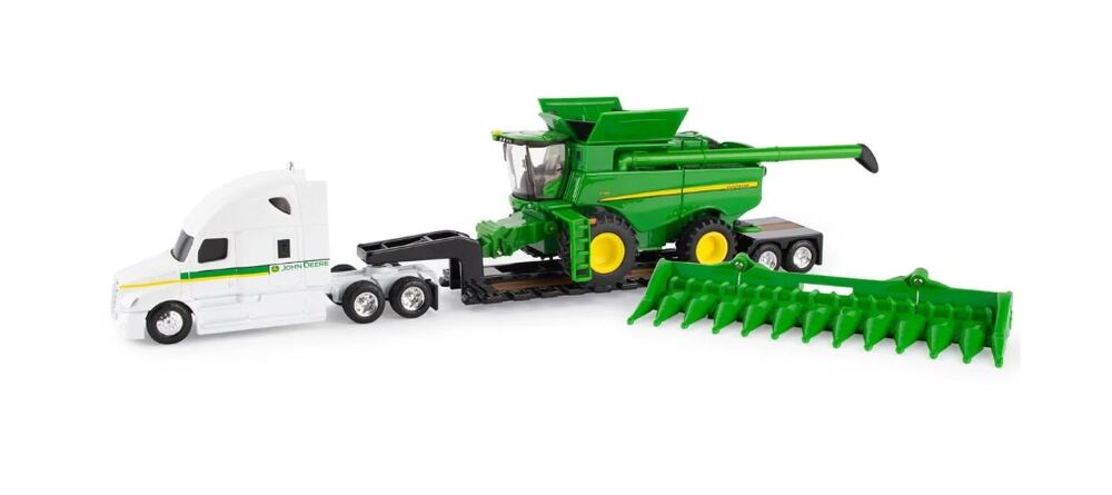 S780 with Freightliner and lowboy trailer