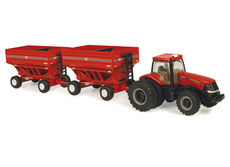 CASE/IH 215 MAGNUM with 2 GRAVITY FEED OUT TRAILERS