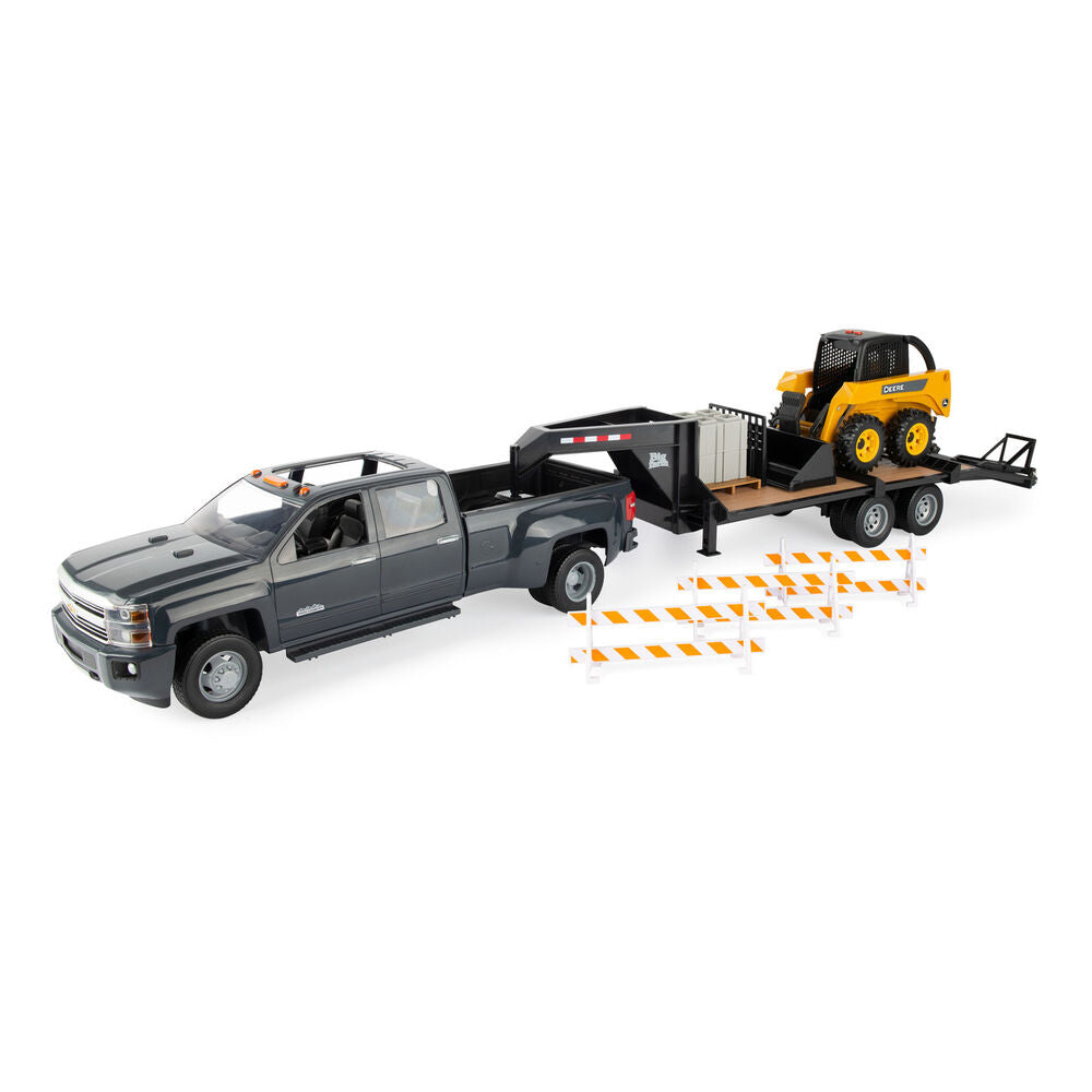 Skid steer, trailer and chevrolet truck