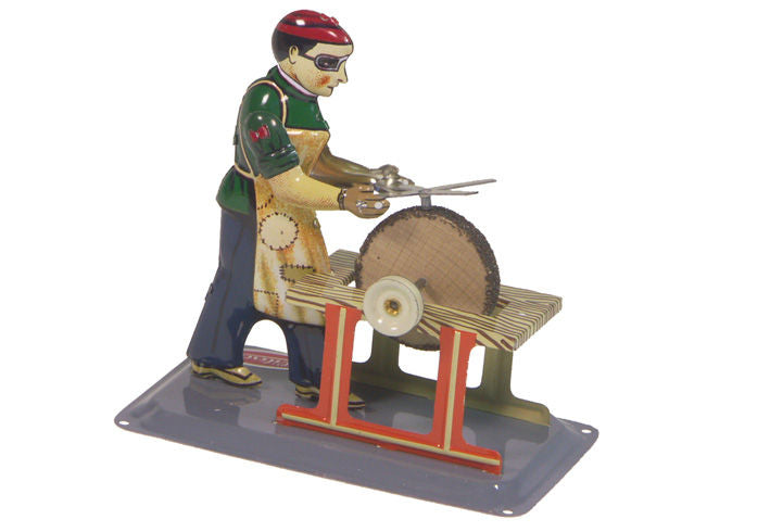 Wilesco grind stone with man