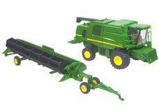 JOHN DEERE T670i HEADER with COMB TRAILER